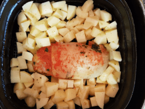 A potato and squid inside an air fryer