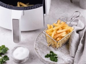 White Air Fryer beside a crispy and golden fries