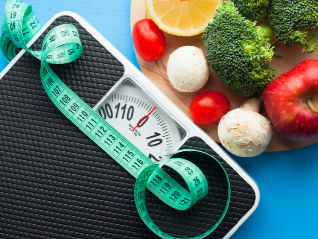 A weighing scale and vegetables