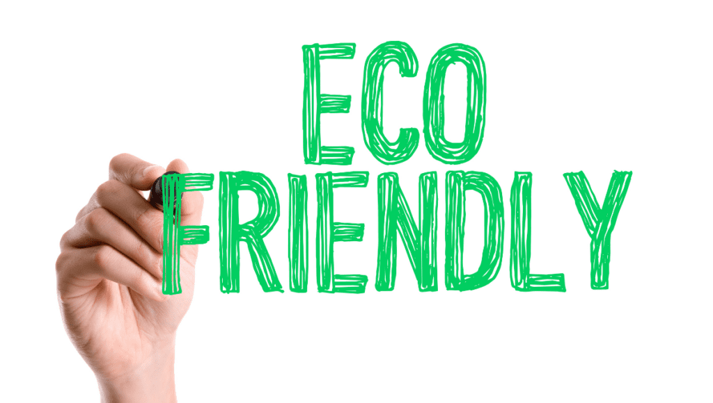 A hand writing "Eco Friendly" in green marker.