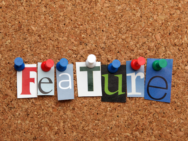 A colorful corkboard with the word "Feature" spelled out using cut-out letters and push pins.