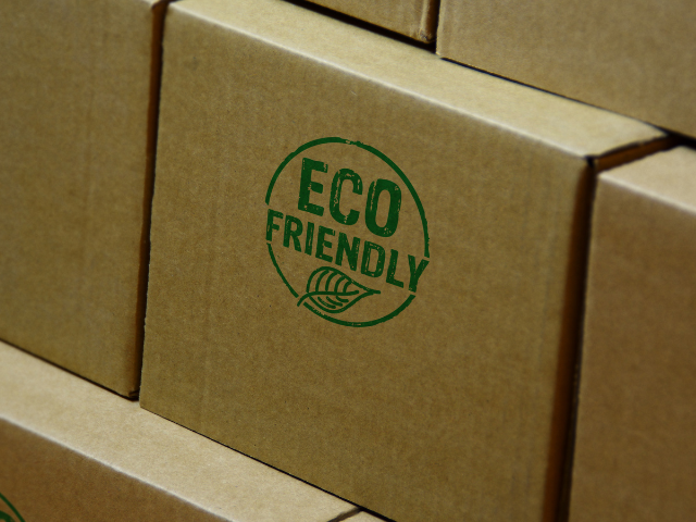 Cardboard boxes with an "Eco Friendly" stamp.